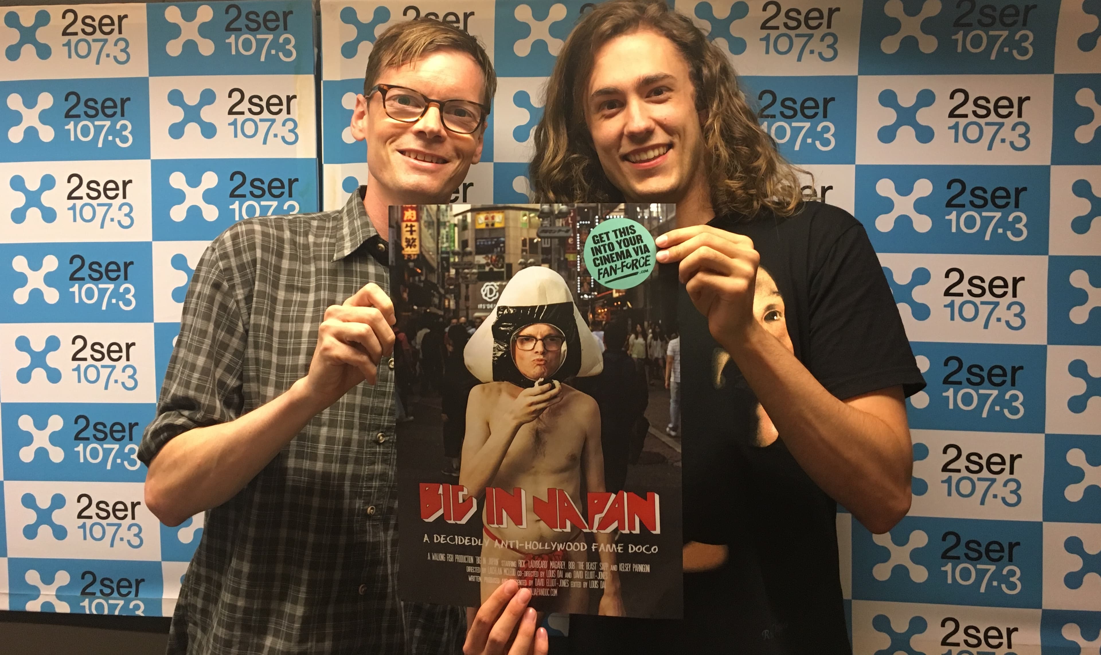 Monday Drive host, Bryce Mills, posing next to Big in Japan writer and producer, Dave Elliot-Jones