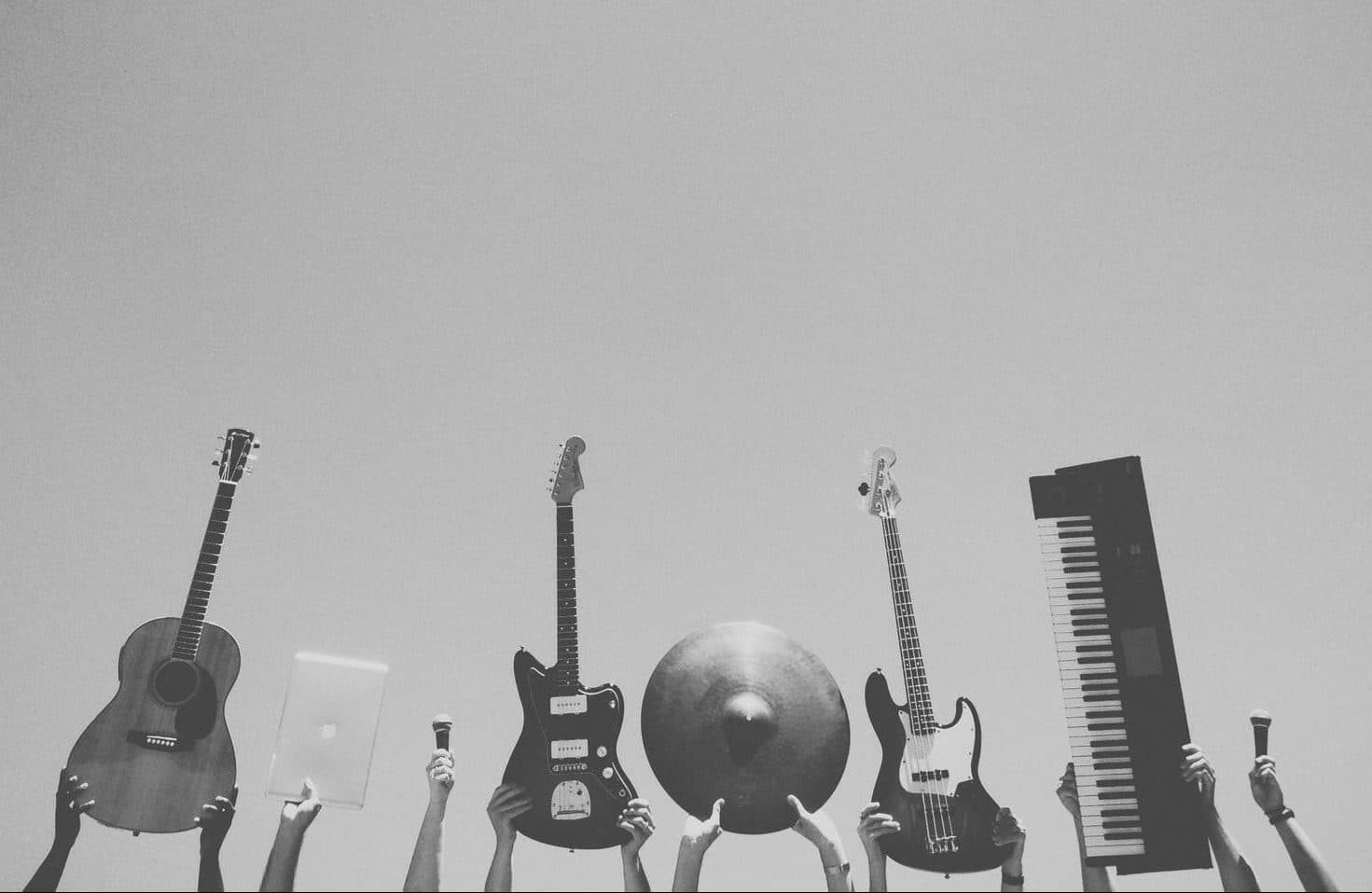 various musical equipment held up high