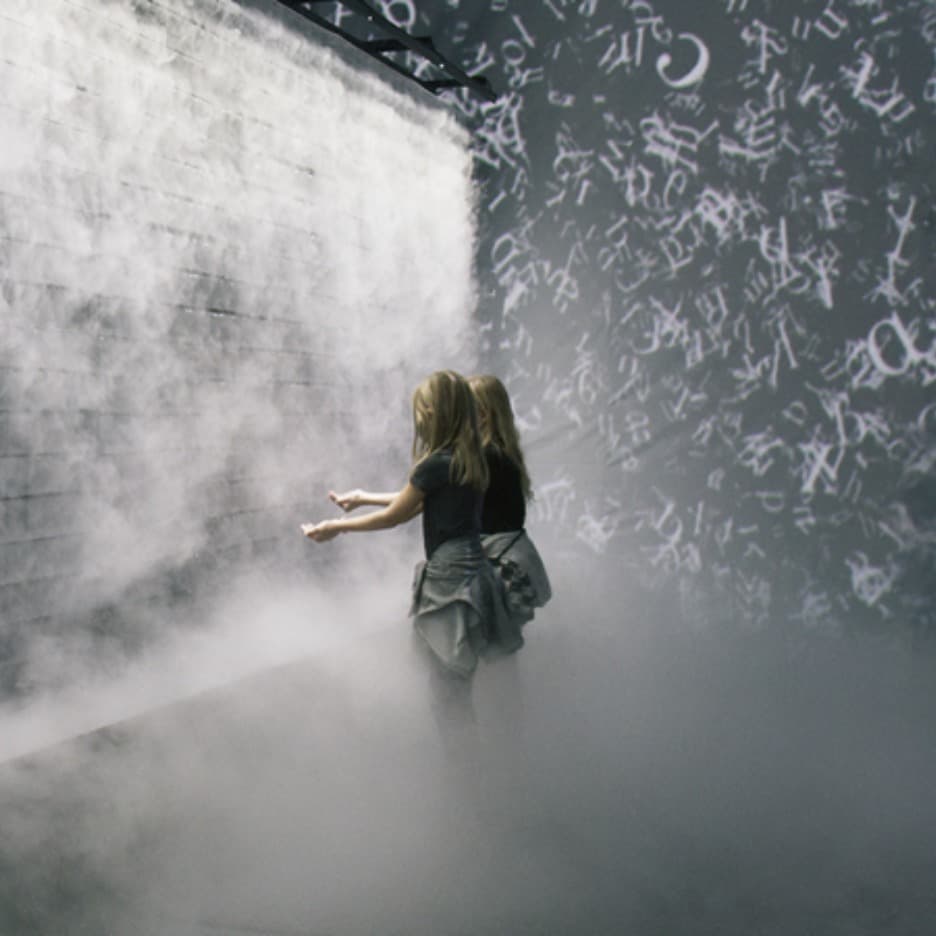 Two girls exploring the interactive space at Atmospheric Memories exhibition
