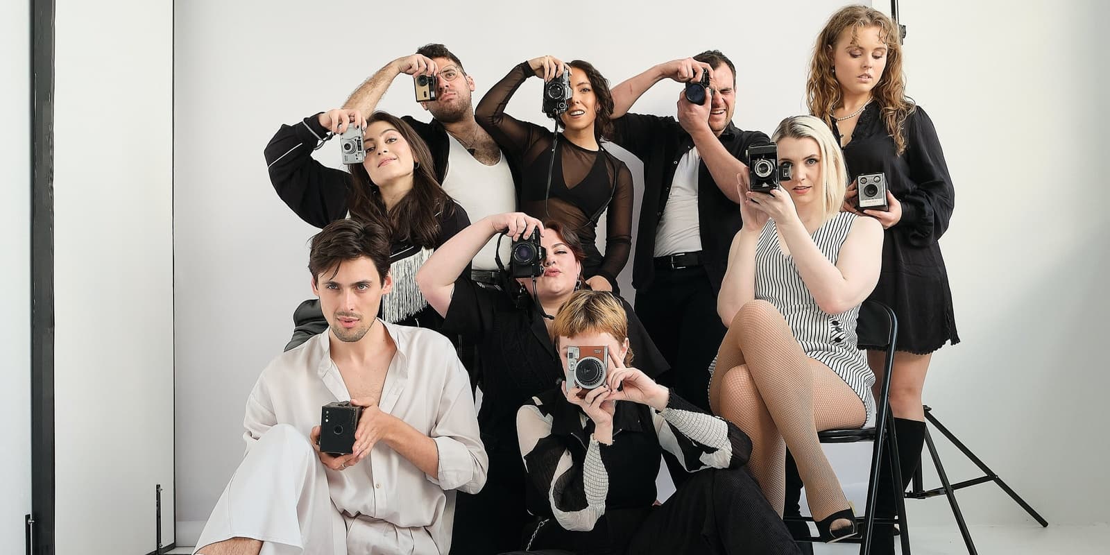 35mm: A Musical Exhibition cast member. Little Triangle members. 9 actors with 35mm film cameras. Shooting film cameras.