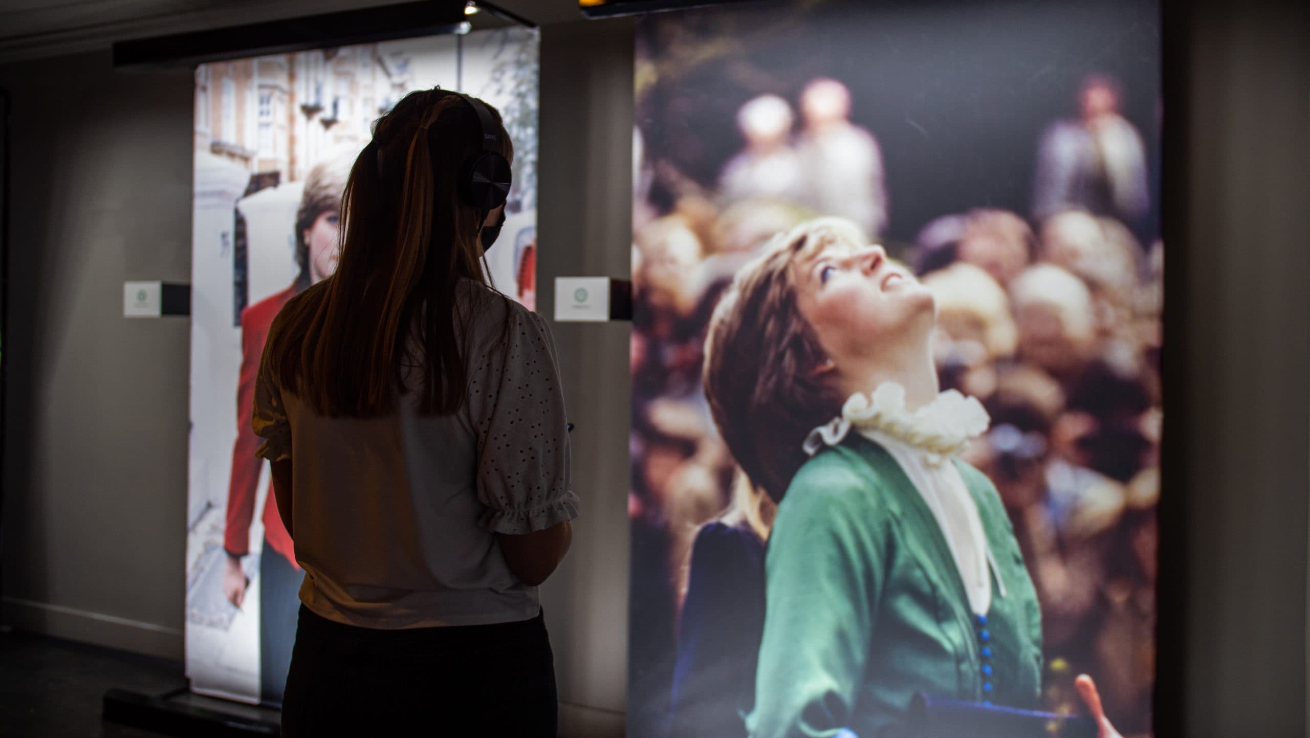 Princess Diana Exhibition. Woman viewing Princess Diana photograph.